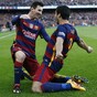Messi and Suarez give Barca title advantage against 9-man Atleti