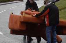 A video of two Tyrone fellas struggling to move a couch down a hill has gone global
