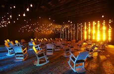 It's dark, you're sitting on stage in a rocking chair, and a woman's voice booms out...