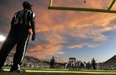 WATCH: A streaker dressed up as a referee caused a bench-clearing brawl at this college football game last night