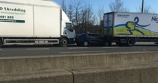 Three trucks crashed on the M50 and a car was caught in the middle