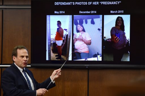 District Attorney Stan Garnett shows pictures of the defendant, Dynel Lane, accused of cutting a stranger's unborn baby from her womb.