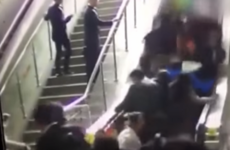 Watch the moment that an escalator reversed and caused a huge pile up