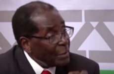 92-year-old Robert Mugabe just threatened to punch a journalist
