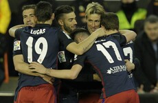 Torres on target as Atleti keep title hopes alive with win against Neville's Valencia