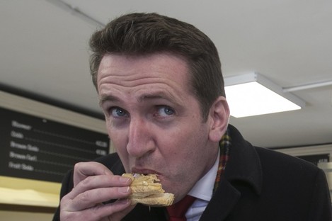 Aodhán Ó Ríordáin eating a cake during last month's election campaign 