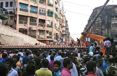 At least 20 dead as bridge collapses on crowds in India