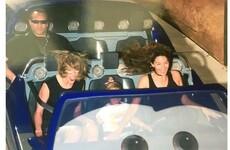 This photo of Taylor Swift's bodyguard having zero craic on a rollercoaster is brilliant