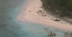 Men rescued from desert island after writing 'HELP' with palm leaves