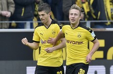 After Euro exit, Dortmund stay in touch with Bayern as 'next big thing' makes history