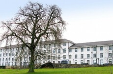 Patients left lying on trolleys while 40-bed unit remains vacant at nearby hospital