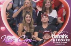 This woman passionately eating pizza on a Kiss Cam is your spirit animal