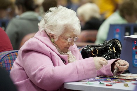A woman playing bingo at Rock Bingo in Cork, before its closure