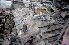 Kenyan rescuers try to reach woman and child trapped in collapsed building
