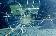 Windscreen of police car smashed with officers inside