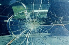 Windscreen of police car smashed with officers inside