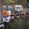 Police begin searches after arrests at paramilitary-style funeral
