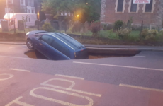 A car fell down a massive sinkhole in London this morning