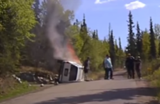 WATCH: Police officer saves man trapped beneath burning SUV