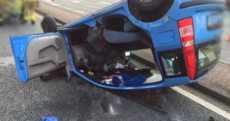 Driver cut out of car after becoming trapped in rollover