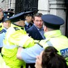 Scuffles between water charge protesters and gardaí as Alan Kelly arrives at the Dáil