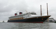 The Disney Magic cruise ship just docked in Dublin and it's Donald Duck-ing huge