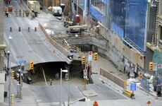 A giant sinkhole has swallowed a van and caused evacuations in Ottawa