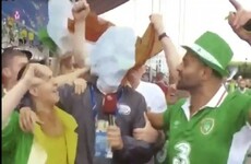 These Irish fans were having serious craic behind a TV reporter after the match