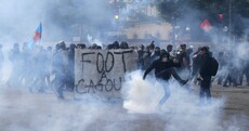 Paris protesters throw missiles at police as demo descends into violence