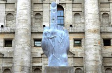 Italian artist unveils 20 foot middle finger to stock exchange