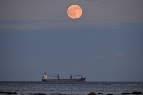 The full moon, known as the strawberry moon, rises near Whitley Bay in England earlier this month. 