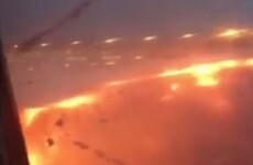 Fire engulfs wing of passenger plane after emergency landing