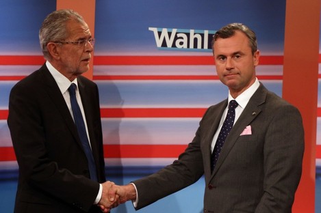 Alexander Van der Bellen candidate of the Austrian Greens, left, shakes hands with Norbert Hofer, candidate for president of Austria's Freedom Party, (FPOe).