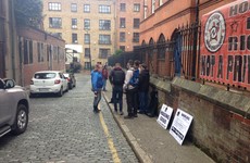 Gardaí arrive as residents protest closure of homeless hostel