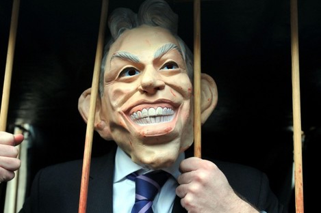 A protester in a Tony Blair mask as the former Prime Minister gave evidence before the inquiry. 