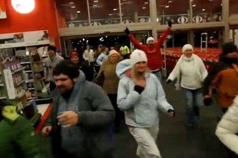 Shoppers rush into a shop at 4am on Black Friday in 2010 to ensure they pick up a bargain
