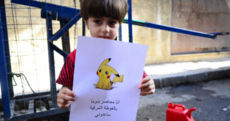 Syrian children pose with drawings of Pokemon, pleading to be saved from violence