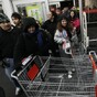 Woman who allegedly pepper-sprayed Black Friday crowd surrenders