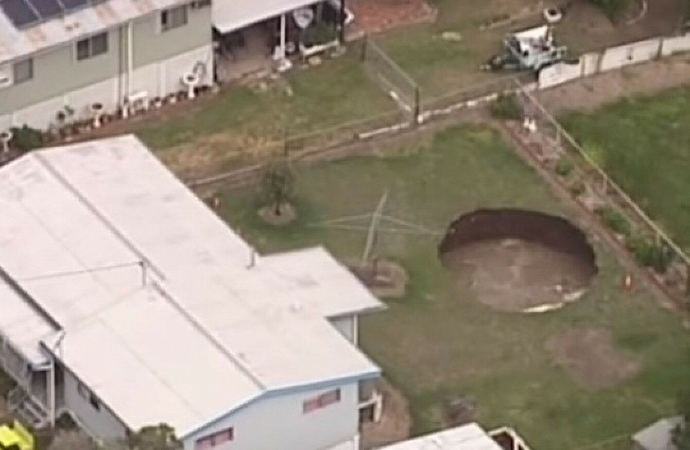 Australian couple wake up to find giant sinkhole in their back garden