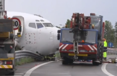 Cargo plane overshoots runway and skids into road at Milan airport