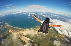 Thirteen skydivers parachute from burning plane after bird causes engine to go on fire