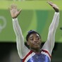 US teenage sensation Biles keeps up bid for a record five women's gymnastics gold