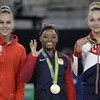 US teenage prodigy Biles secures gold medal hat-trick