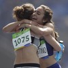 Two runners put medal hopes on hold to help each other finish race after ugly fall