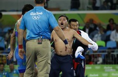 Mongolian wrestling coaches strip off in protest after fighter loses Olympic medal fight