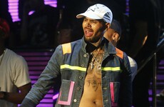 Chris Brown keeps posting videos online as police wait outside