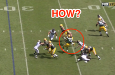 Aaron Rodgers threw an absurd 29-yard touchdown pass while being pulled to the ground by a defender