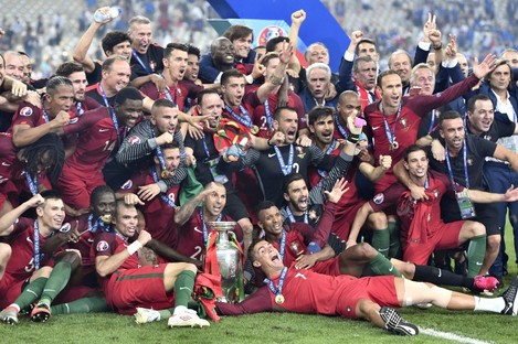 Portugal players celebrate after winning the Euro 2016 final. 