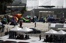 Thousands flee after fire started in Greek migrant camp