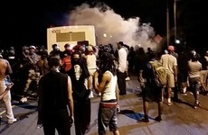 Police injured after community protests the killing of a black man by officer